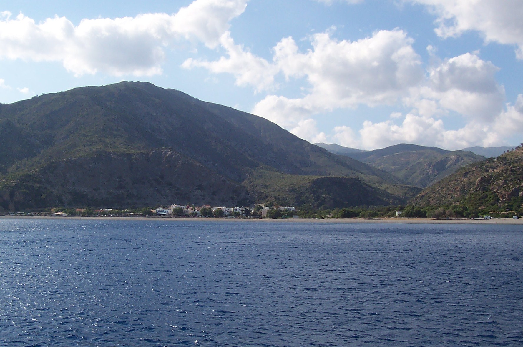 Distant view of Sougia Beach taken from a boat at sea - Nudist beach in Crete. Distant view of Sougia Beach taken from a boat at sea - Nudist beach in Crete.